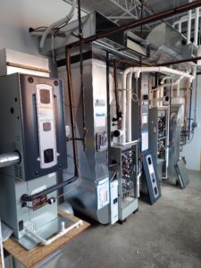 commercial furnace set up in basement or boiler room