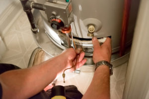 Technicians installing water heater