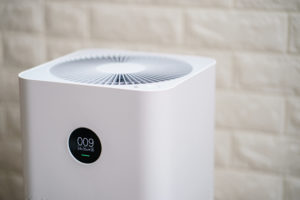 Closeup of  Air purifier with monitor screen, show air quality in the room. PM2.5 concept.
